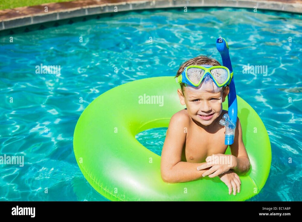 young-kid-having-fun-in-the-swimming-pool-on-inner-tube-raft-summer-EC1A8P.jpg